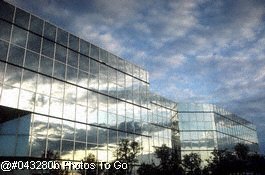 Reflection of clouds on glass building